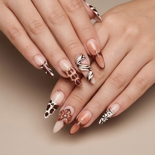 Savanna Luxe – animal print stiletto press-on nails with crystals and a 3D flower worn on hand