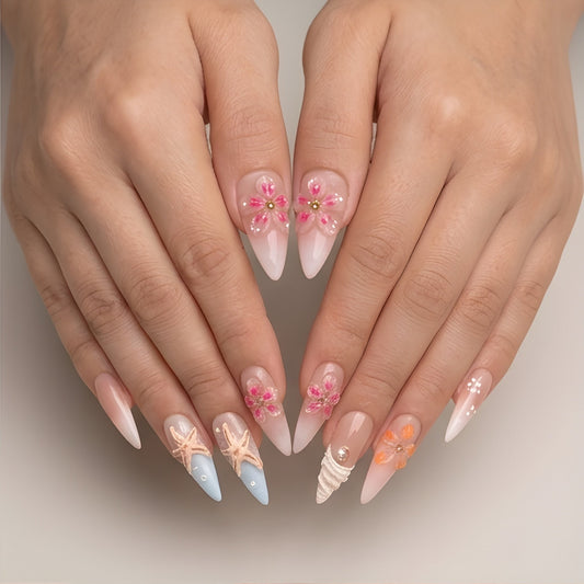 Coral Shore – stiletto press-on nails with 3D starfish, seashell and flowers worn on hand