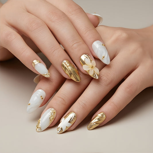 Gilded Pearl – marble white and gold chrome almond press-on nails with 3D flowers worn on hand