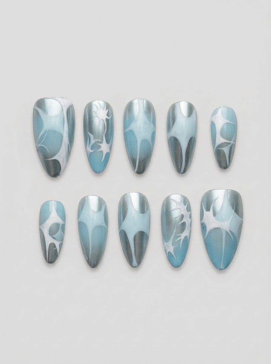 Glacier Chrome – set of 10 handmade icy blue and silver chrome almond press-on nails with white starburst art