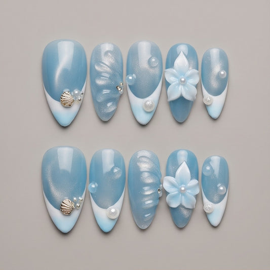 Ocean Mist – set of 10 handmade shimmer blue French tip almond press-on nails with a 3D flower and seashell charm